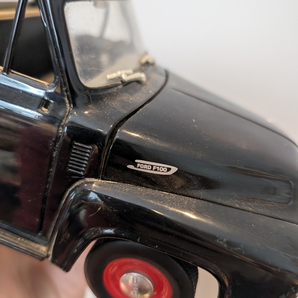 Classic Black Toy Truck with Red Wheels - Picture 2 of 11